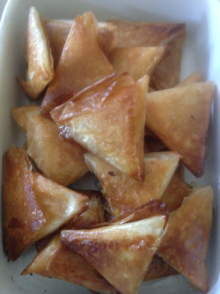 Almond briouats coated with honey syrup